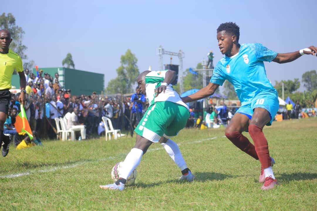 West Nile Province defender Rashid Okocha tussle for the ball with Allan Okello of Lango province during thier first leg final clash in Arua. (FUFA Photo)