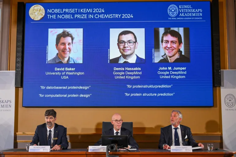 The Royal Swedish Academy of Sciences awards the 2024 Nobel Prize in chemistry to David Baker, Demis Hassabis and John Jumper [Jonathan Nackstrand/AFP]